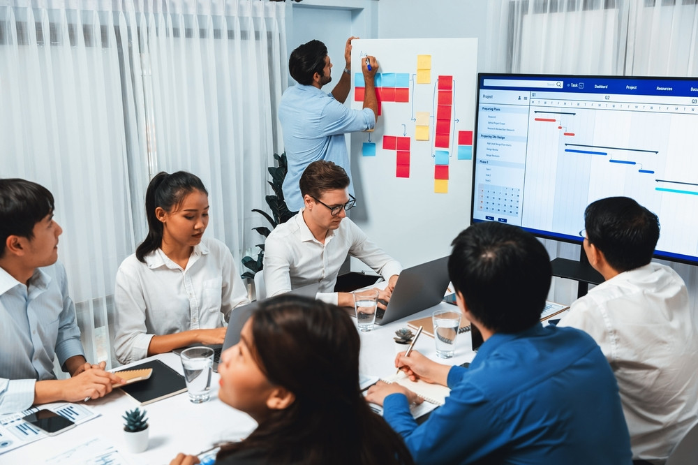 Facilities management team proactively planning compliance strategy for high-compliance sectors