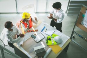 Facilities management team proactively planning regulatory compliance maintenance schedule