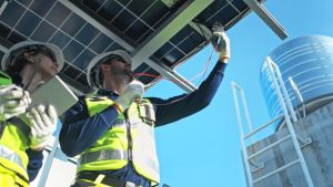 Building engineer inspecting mechanical equipment during a maintenance check