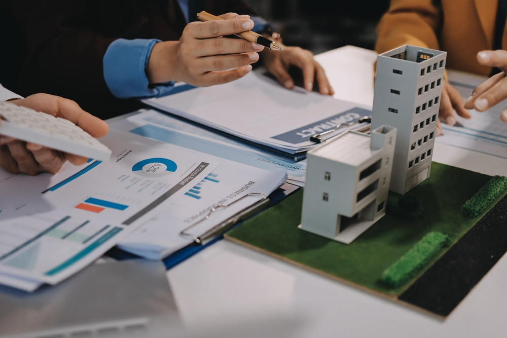 Business handshake representing how to get commercial property maintenance contracts through trust