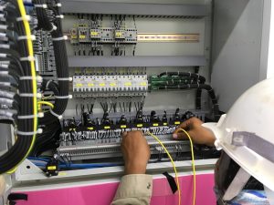 Engineer servicing a commercial building lift done within maintenance charges for commercial property