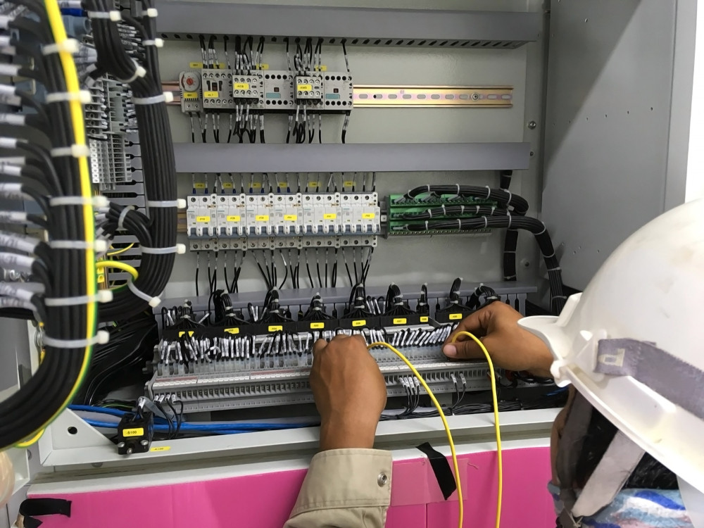 Engineer servicing a commercial building lift done within maintenance charges for commercial property